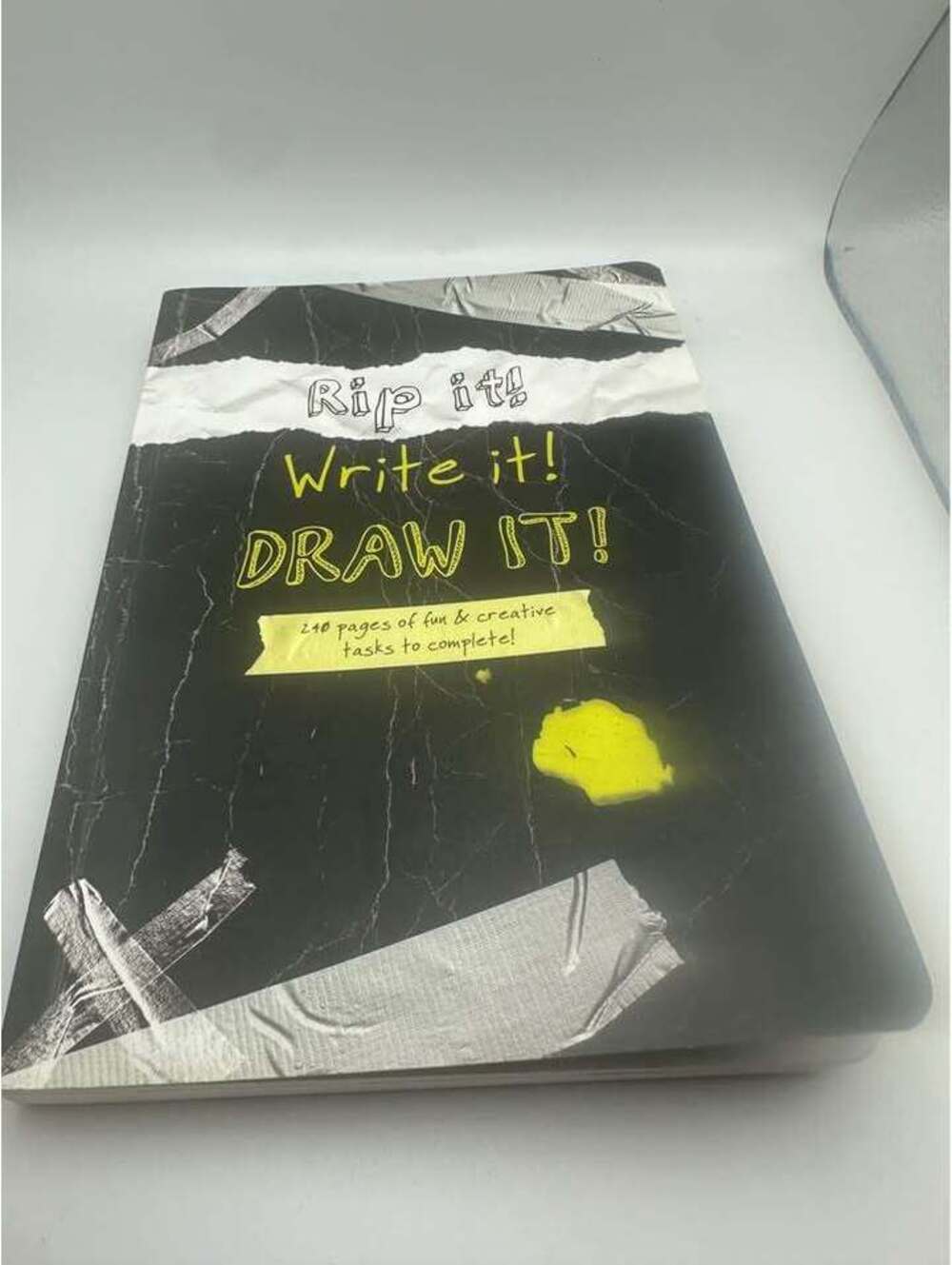 Rip it! Write it! DRAW IT! Activity Book a few pages written on